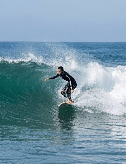 A surfer riding a breaking wave in Durban