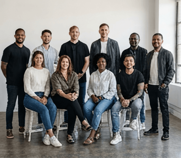 A creative studio team posing together